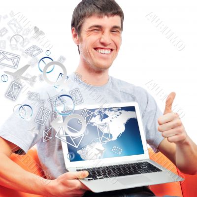 Closeup of a young smiling business man sitting at his home offi