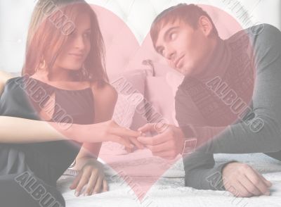 Fashion style photo of an attractive young couple inside luxury 