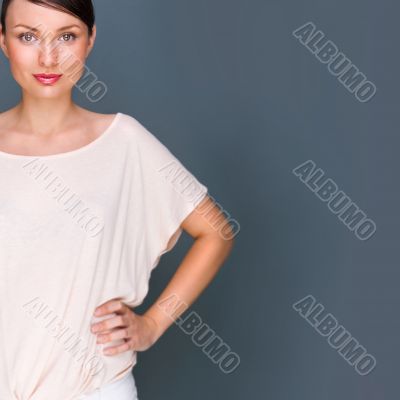 Portrait of beautiful woman looking at camera and holding hands 