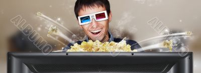 Portrait of young stylish modern man wearing 3d glasses watching