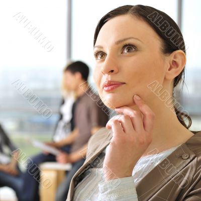 Business woman in an office environment with large stained-glass