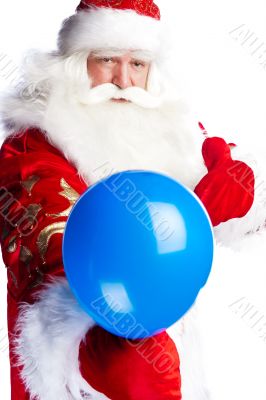 Traditional Santa Claus holding balloons for children. Isolated 