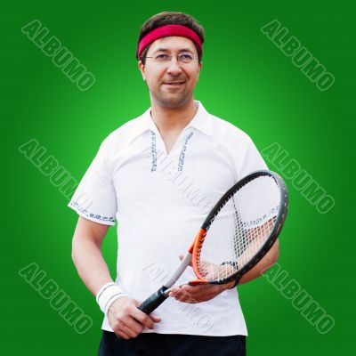 Mature man playing tennis studio portrait