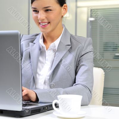 Beautiful business woman thinking about somethinking while worki