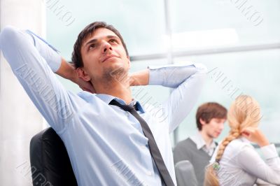 Closeup portrait of a smart young businessman smiling and his co