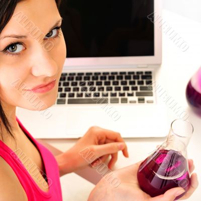 Young business woman on a laptop - isolated on white. doing chem