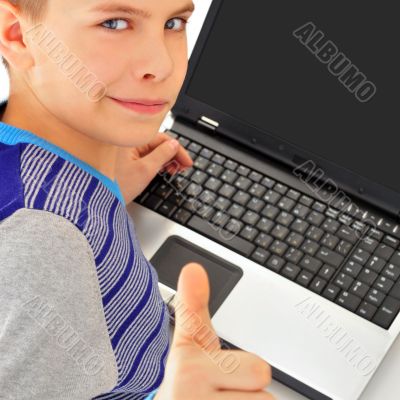 Portrait of a cute little boy using a laptop