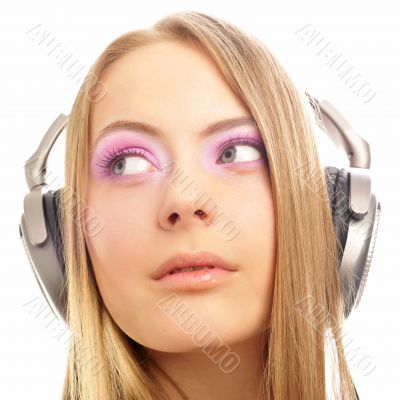 Beautiful woman with headphones, she is listening to the music
