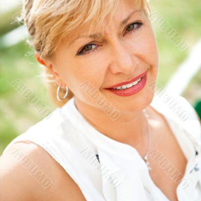 Portrait of a female smiling in a park