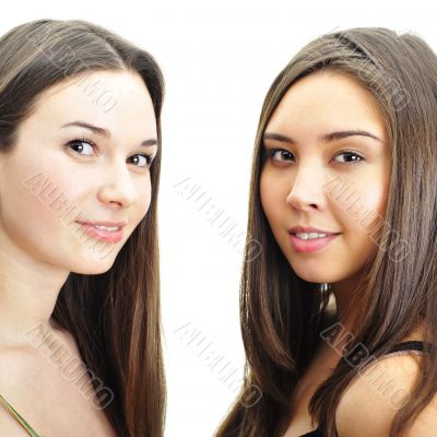 Two women whispering and smiling