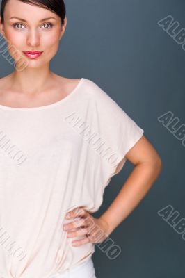 Portrait of beautiful woman looking at camera and holding hands 