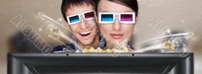 Portrait of young stylish modern couple wearing 3d glasses watch