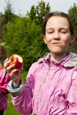 Portrait of happy girl with apple