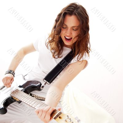 Portrait of young pretty girl who is feeling free and playing gu