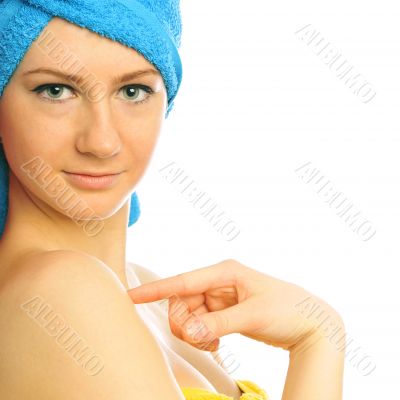Beautiful young woman after shower with towel on her head