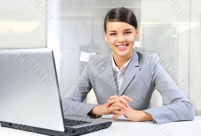 Beautiful business woman thinking about somethinking while worki