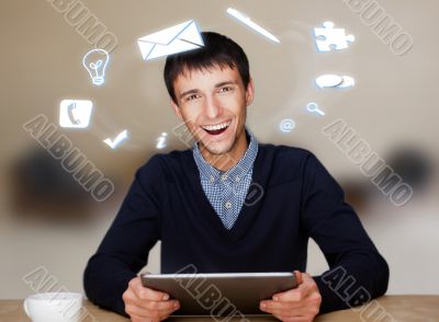 A businessman with icons floating around his head. Portrait of h