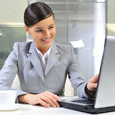 Young business woman on a laptop at her office