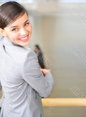 A portrait of a young business woman in an office