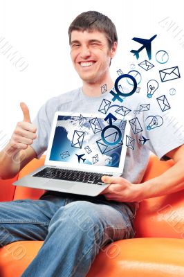 Closeup of a young smiling business man sitting at his home offi