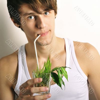 Portrait of young european cute male looking at camera holding g