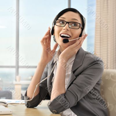Portrait of a beautiful young businesswoman on the phone and hap