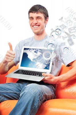 Closeup of a young smiling business man sitting at his home offi