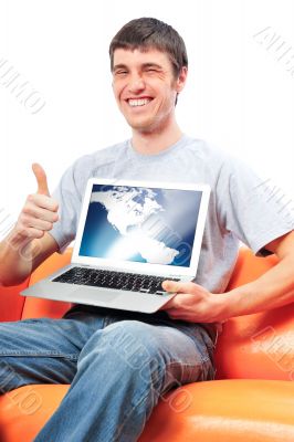 Young man holding his laptop