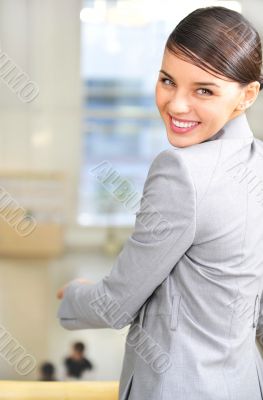 A portrait of a young business woman in an office