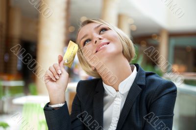 Closeup portrait of cute young business woman smiling while hold