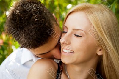 Closeup portrait of smiling young couple in love - Outdoors