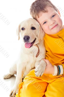 Handsome Young Boy Playing with His Dog Against White Background