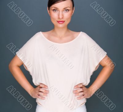 Portrait of beautiful woman looking at camera and holding hands 