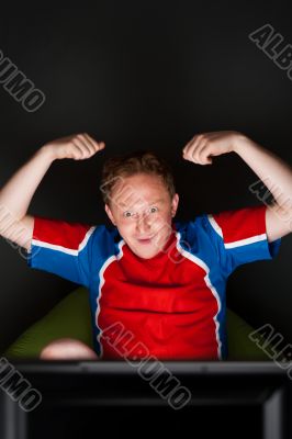 Closeup portrait of young man wearing sportswear fan of football