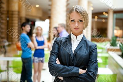 Portrait of a cute business woman with colleagues at the backgro