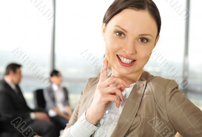 Portrait of a beautiful young businesswoman smiling at a meeting
