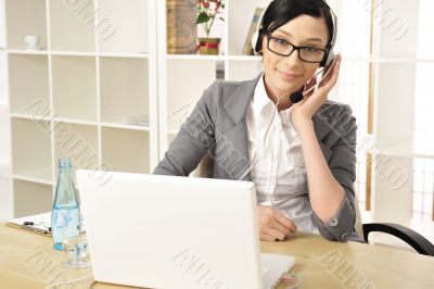 Portrait of a beautiful young businesswoman on the phone and hap