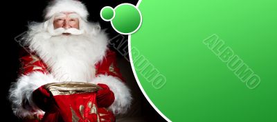 Santa sitting at the Christmas room and looking into the sack. B