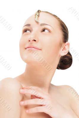 Portrait of a beautiful young woman with jewelery on her forehea