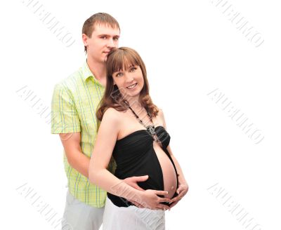 Image of pregnant woman touching her belly with hands