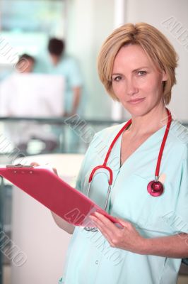 Blond nurse at work.