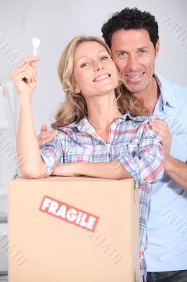 Couple with key to the door