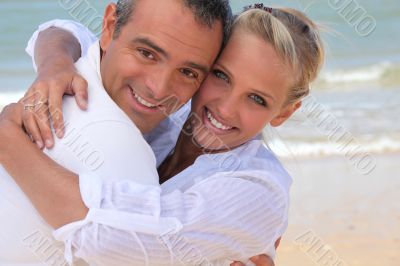 Couple hugging on the beach