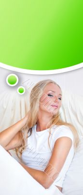 Young blond woman enjoying a sunny morning in bed
