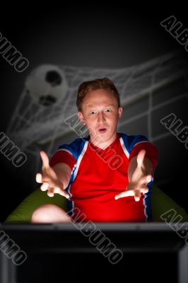 Closeup portrait of young man wearing sportswear fan of football