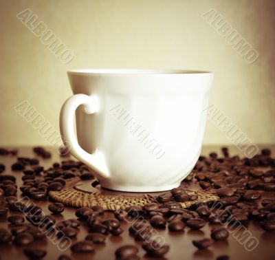 warm cup of coffee on brown background
