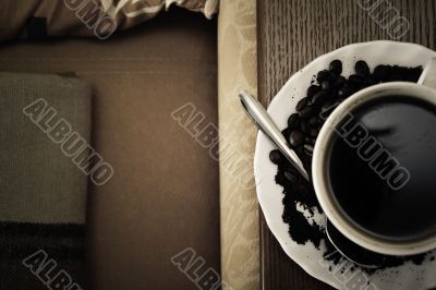 warm cup of coffee on brown background