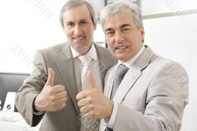 Portrait of two businessmen who approve.