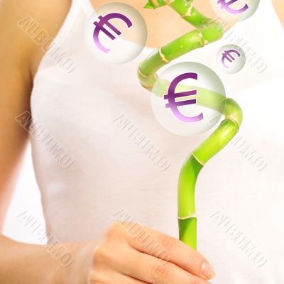 Young woman wearing white underwear holding lucky bamboo in her 