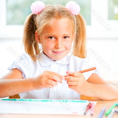 Little girl looking for a drawing concept wile painting picture 